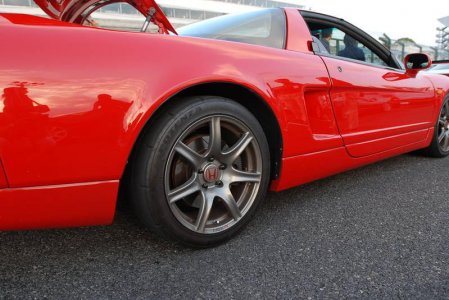 NSX-R wheels in gunmetal with red H center caps.jpg